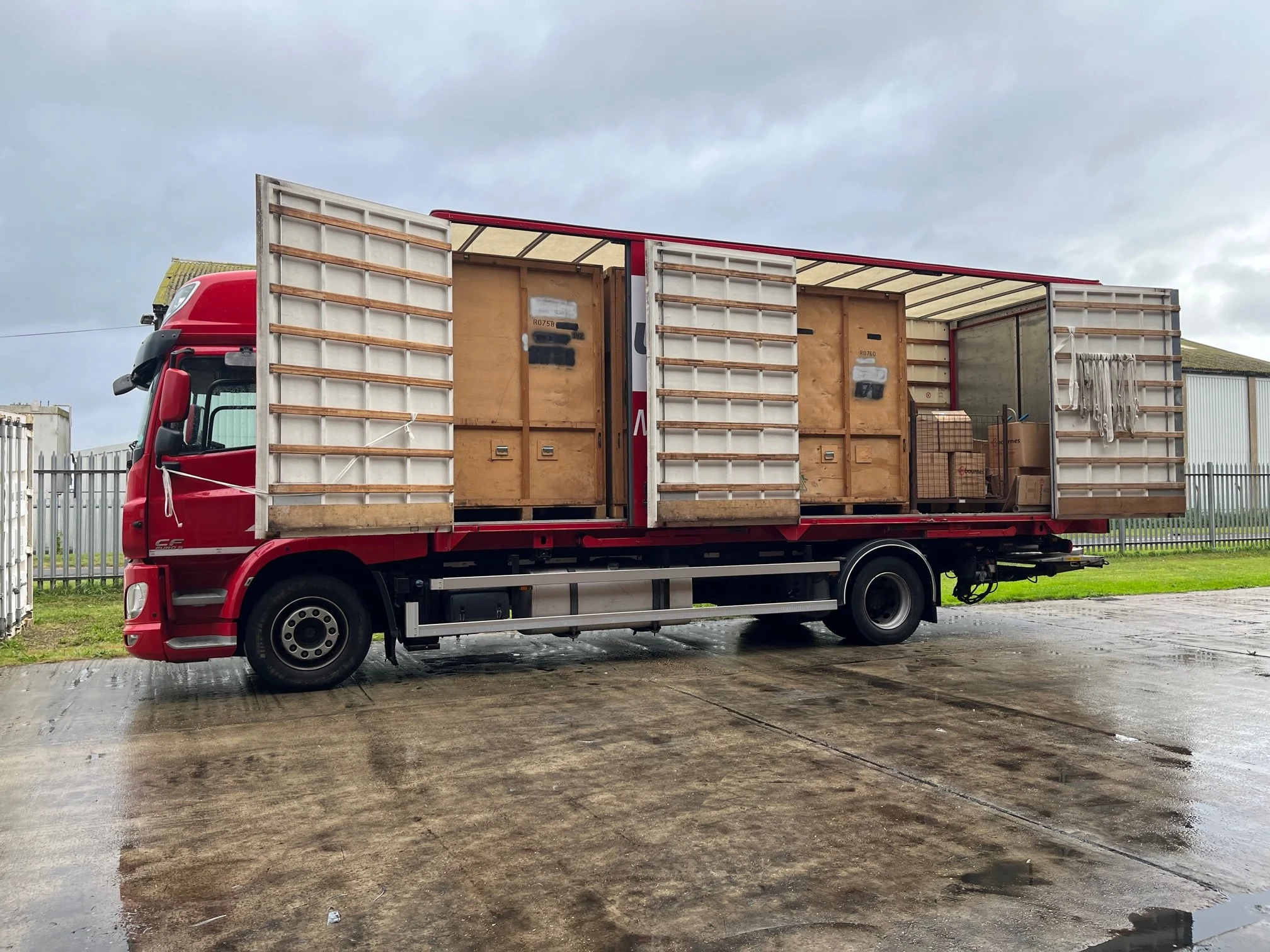 storage-containers-loaded-on-red-truck.webp